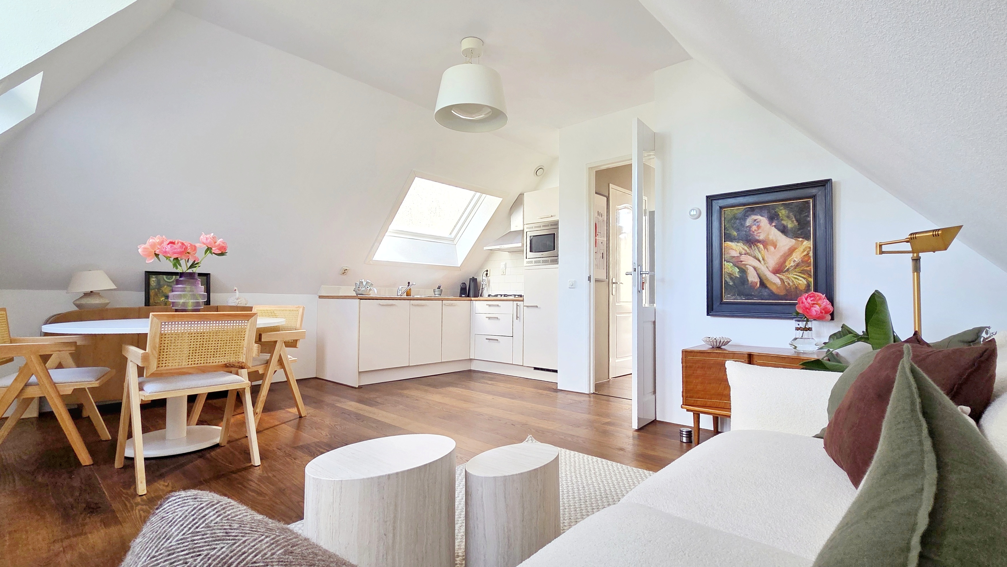 Bright Amsterdam attic apartment with open living and kitchen area